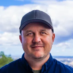 Gert Jansen van Rensburg - Profile photo outdoors wearing a cap